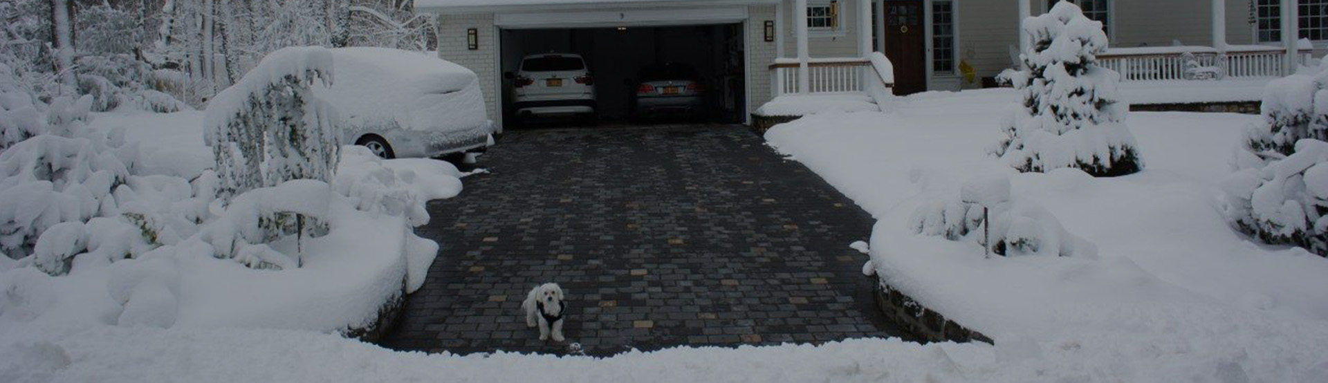 A heated driveway in operation during a storm
